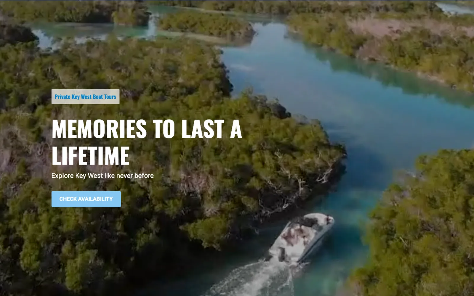 Home page of a boat trip website on a laptop: an aerial view of mangrove islands and a boat, white capitals and a light blue button