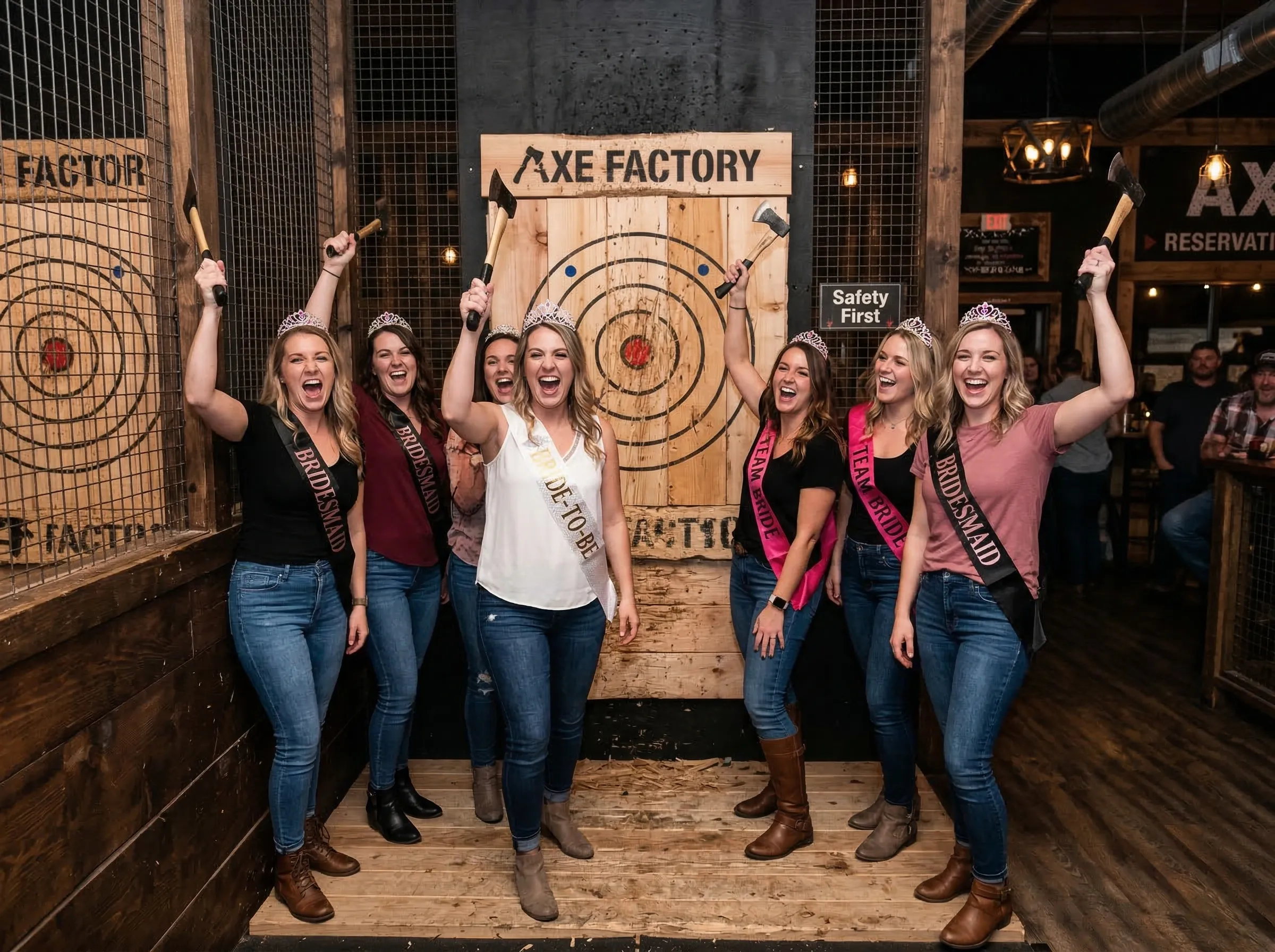 Bachelorette party group celebrating with axes raised