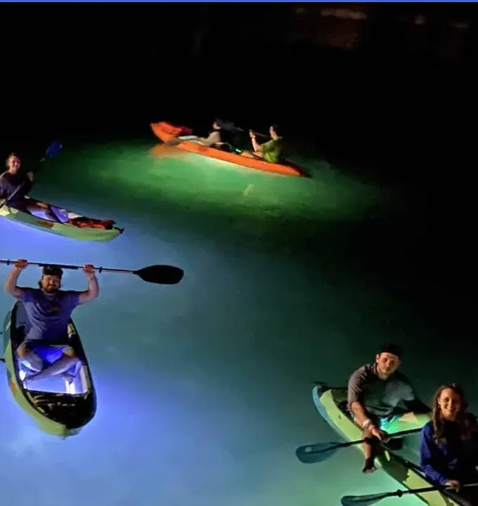 Night Kayak Key West guests paddling illuminated kayaks together